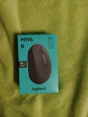 Logitech M196 Wireless Mouse - Teal Box with Gray Mouse Image